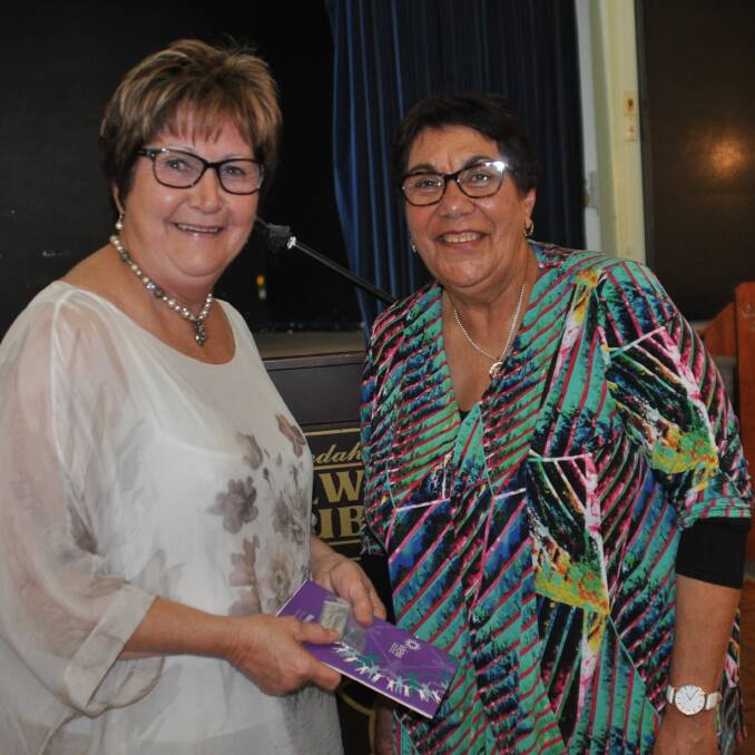 New member Pauline Grant, left, received her badge and membership pack from vice-president Kate Knight.