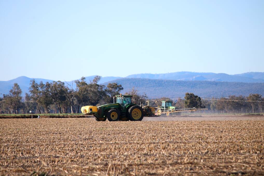 North West Local Land Services' Bill Manning says farmers can no longer rely solely on herbicides to combat weeds. Pictured is a spray rig in operation on an Emerald Hill farm on Thursday. Photo: Vanessa Hohnke