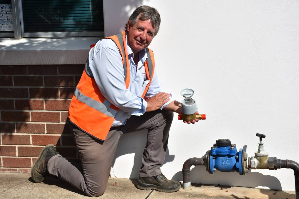 Gunnedah Shire Council’s water services manager Kevin Sheridan with an automatic water meter device. The automatic devices will be installed throughout the shire from December. Photo: Supplied