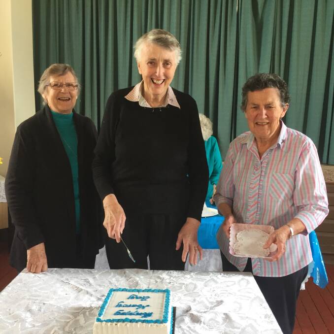 Sr Christine Belling, Sr Regina McInerney and Sr Gabrielle Foley RSM cutting the Mercy Day cake. Photo: Jacinta Stanley