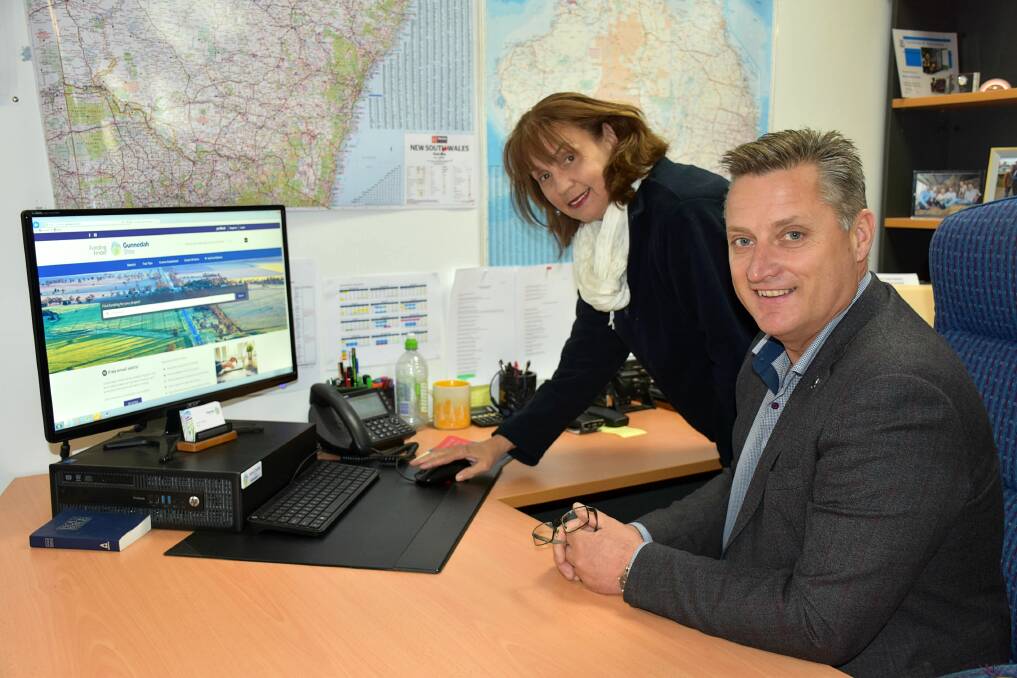 Gunnedah Shire Council's community and social planner Deborah Hilton and shire mayor Jamie Chaffey checking out the Gunnedah Shire Funding Finder.