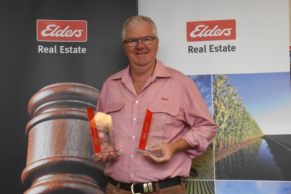 ACCOLADES: Elders Real Estate Gunnedah's Ian McArthur with two of his awards. Photo: Supplied