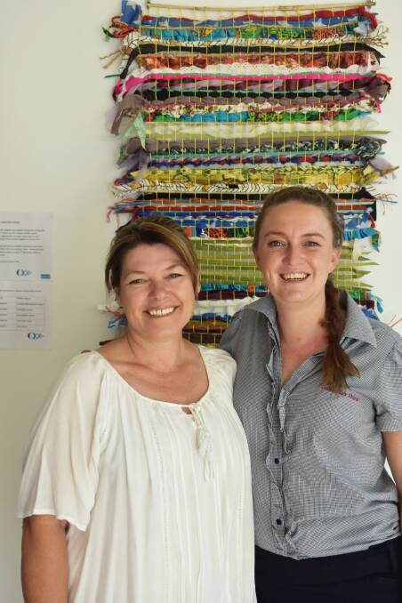 Sunburnt Treasures' Polly Montgomery and council's Lauren Mackley with the weaving.