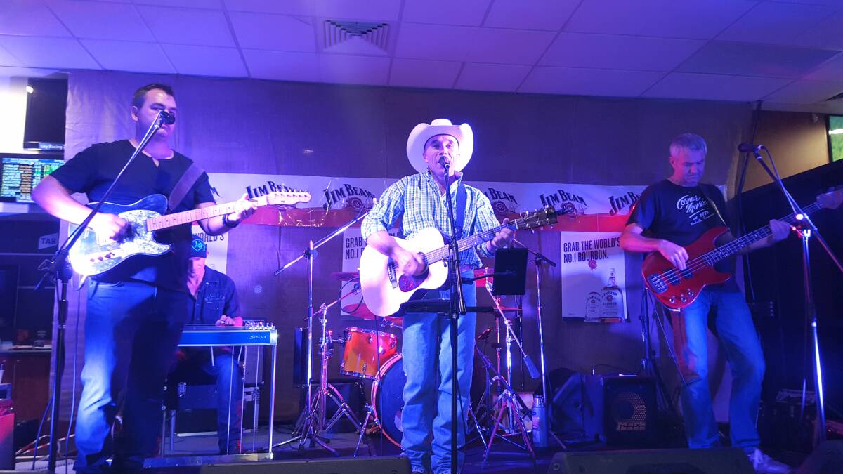 Dan Murphy (centre) performing at the festival last year with Lance Birrell (right) and Gunnedah's Trevor Stacey (left). Photo: Mel Birrell