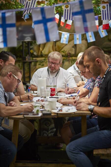 Judges taste and rate the steaks. Photo: Global Meat News
