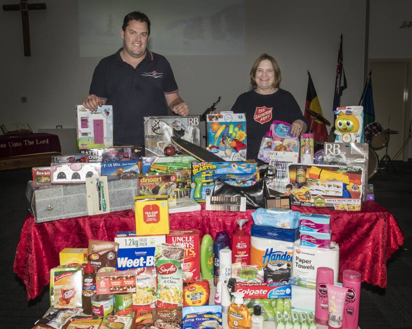 Captain Richard Day and Major Gaye Day with some of the items already donated for the Salvation Army's Christmas appeal. Photo: Peter Hardin