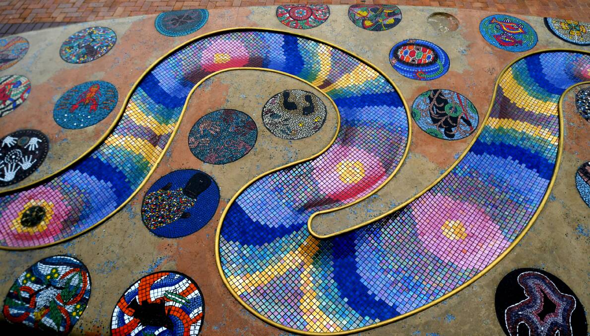 The circular mosaics were created by hand using glass tiles. Photo: Gareth Gardner