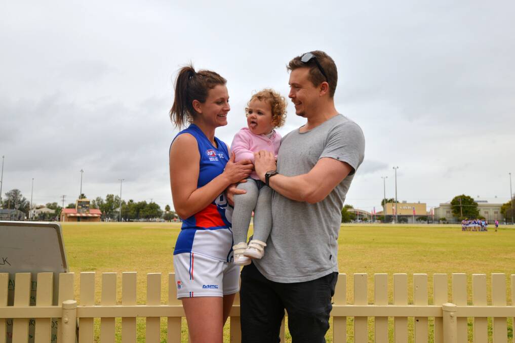 FAMILY TIES: Bulldogs player-coach Louise Kestles, Harper and Lee Rose. Photo: Mark Bode