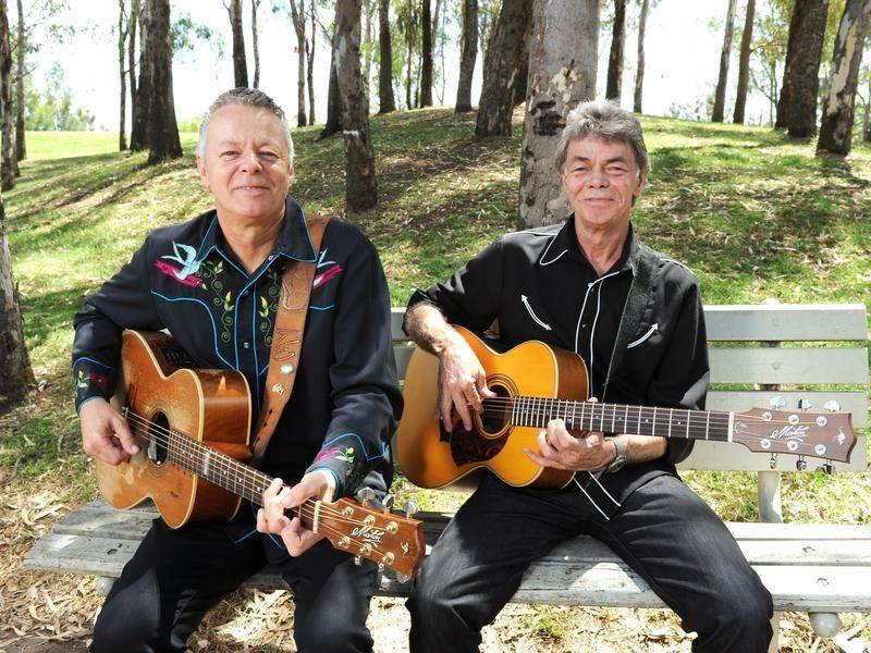 Recognised: Tommy Emmanuel with his late brother Philip Emmanuel (right) who has been honoured with an Order of Australia (OAM). Photo: Supplied