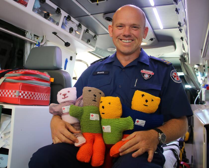 HOMEMADE HELP: Gunnedah Ambulance Station officer Scott Clarke says he always has a Trauma Teddy up his sleeve to comfort children.