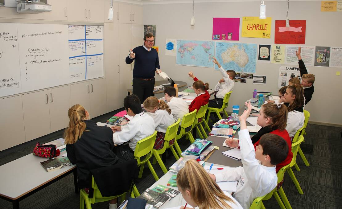 Alex Wharton teaching English at Carinya's middle school.