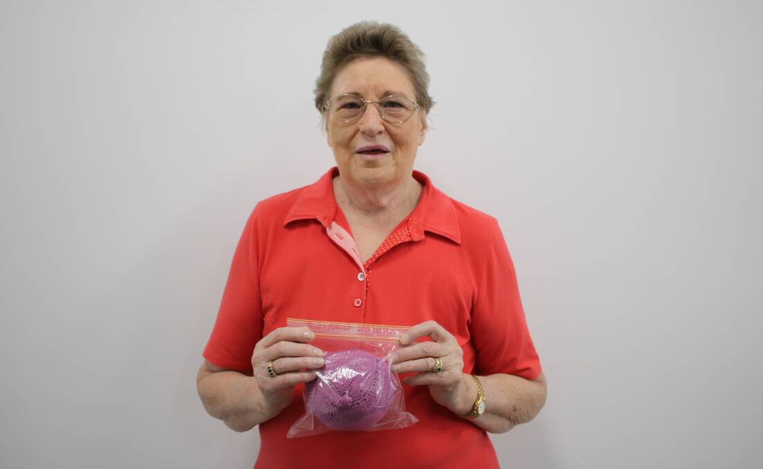 Gunnedah woman and breast cancer survivor Yvonne Argent with a completed "knitted knocker". 