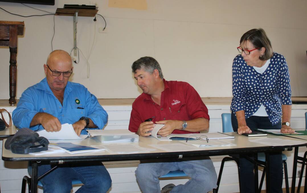 Caroona Coal Action Group's Graeme Norman, John Hamparsum and Susan Lyle discuss the new report in Breeza last week.
