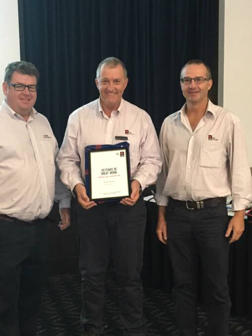 Geoff Dawson (centre) is recognised for 40 years in the business. He is pictured with NAB Agri Business' Khan Horner and Warrick Grieve. Photo: Supplied