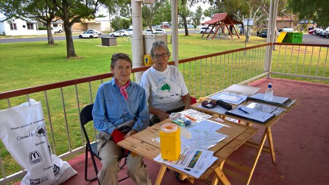 Martine Moran and Annette Percy at the registration desk on Clean Up Australia Day in 2017. Photo: Marie Low
