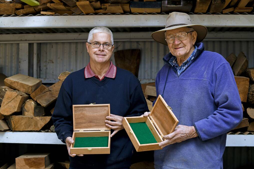 MADE WITH LOVE: Gunnedah Woodturners' Peter Grace and Graham Murrell with the handcrafted awards for this year's Dorothea Mackellar poetry competition. Photo: Two Cats Creative, Alyssa Barwick