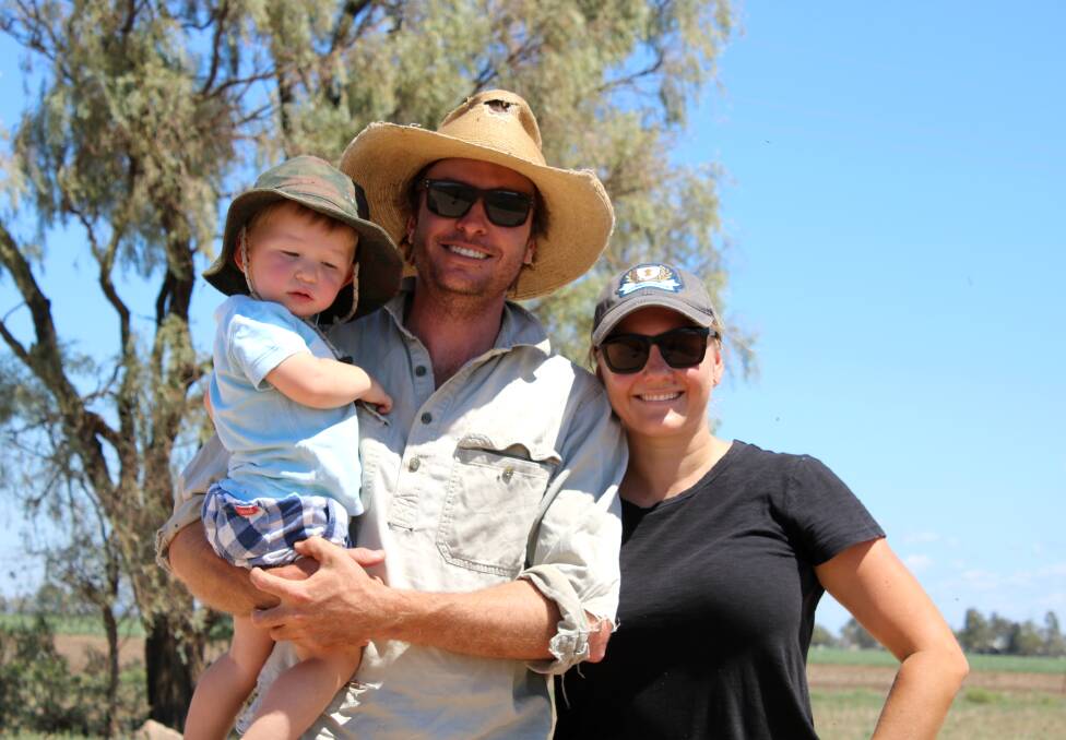 Josh and Lizzy Bell with their youngest Harry following the announcement of state funding for the Grain Valley Road on Friday.
