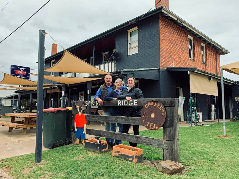 Family affair: Tom and Robyn Archer with their daughter Niccole in their last days running the Spring Ridge Royal Hotel, which has sold to another local. Photo: supplied