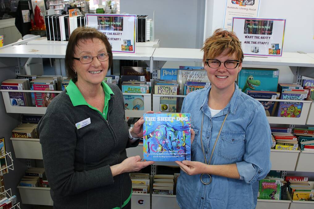 Jade Punch (right) donates a copy of her first children's book to the Gunnedah Shire Library. She is pictured with acting librarian Robyn Draper on Wednesday.