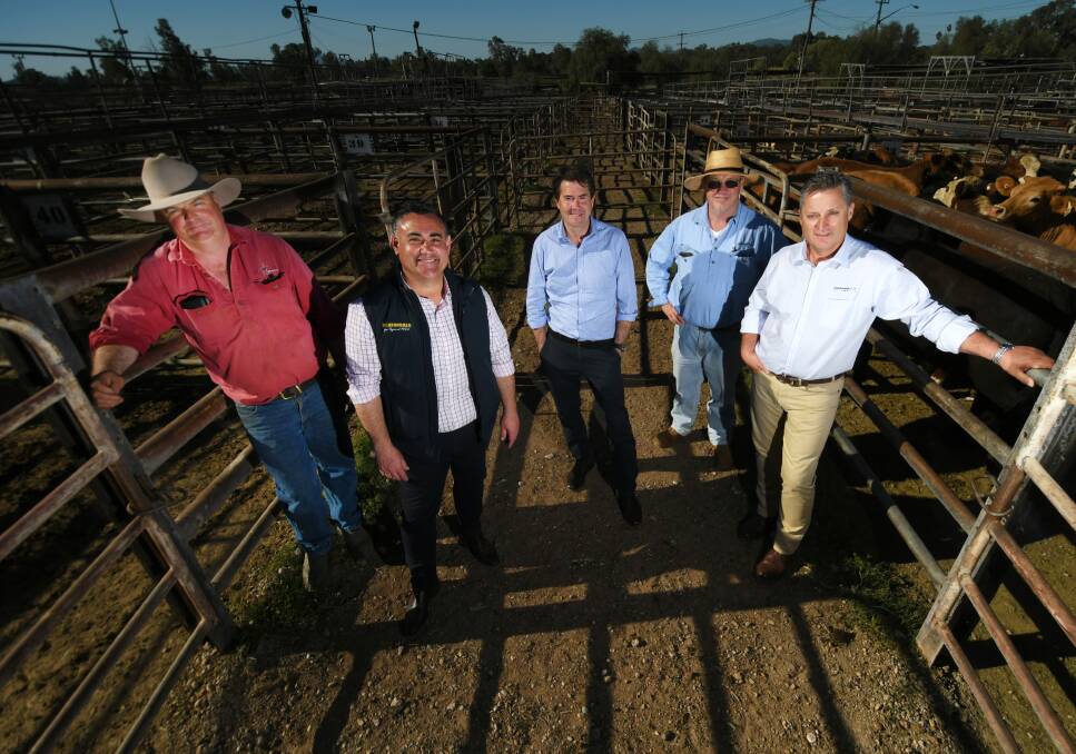 Cattle and sheep producer Peter McArthur, NSW Deputy Premier John Barilaro, Tamworth MP Kevin Anderson, saleyards manager Doc Morrison and Gunnedah shire mayor Jamie Chaffey at the announcement on Tuesday. Photos: Gareth Gardner