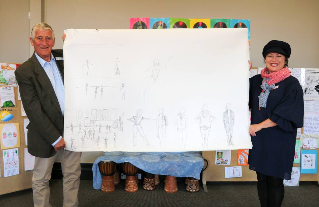 Gunnedah shire deputy mayor Rob Hooke and Gunnedah Conservatorium's Larni Christie with sketches from a recent workshop in preparation for November's cabaret show.