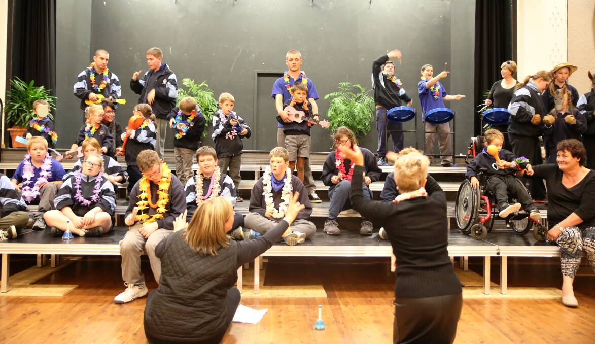 Marg Amos, front, right, at the Gunnedah Eisteddfod with GS Kidd students.