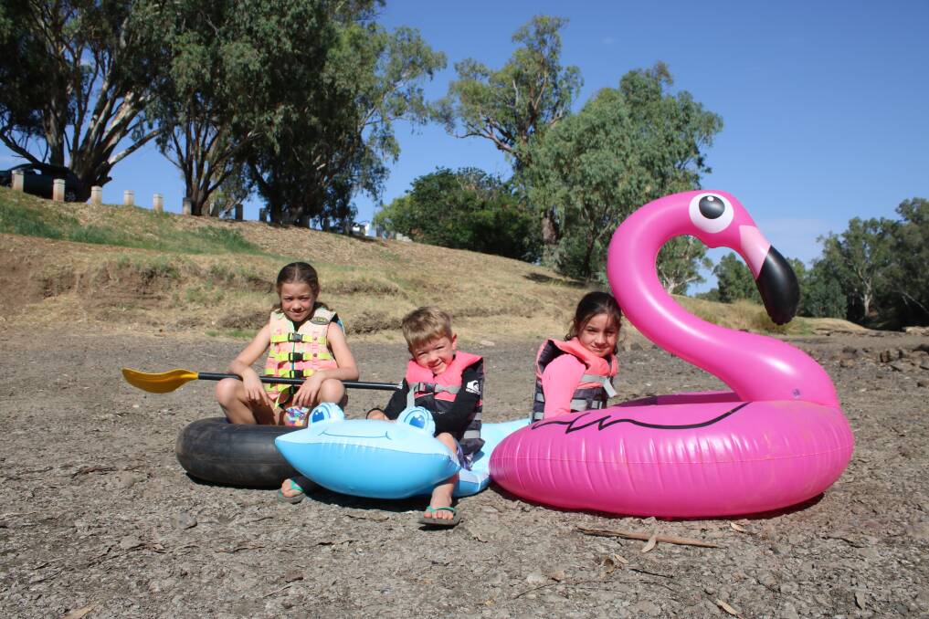 Gunnedah's annual raft and craft race was canned in January because the Namoi had run dry at the finish line. Pictured are Claire (9), Paddy (5) and Georgia Dowe (8).