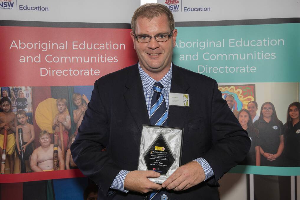 Gunnedah South Public School principal Peter Baum with the NSW Department of Education and Aboriginal Education Consultative Group Partnership Award. Photo: Supplied