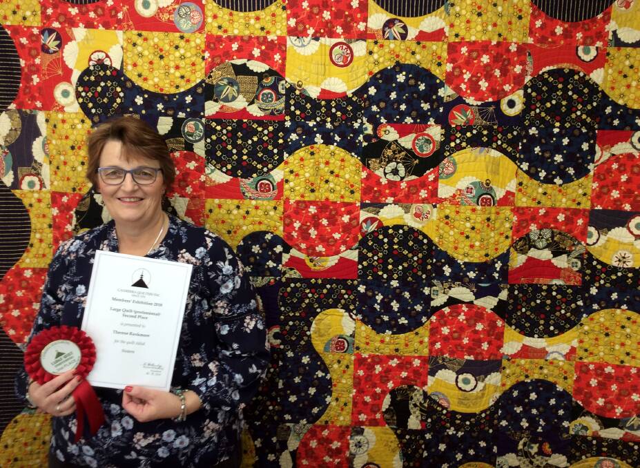 Gunnedah's Therese Rankmore with her quilt, which placed second in the Canberra Quilters Annual Members Exhibition. Photo: Supplied