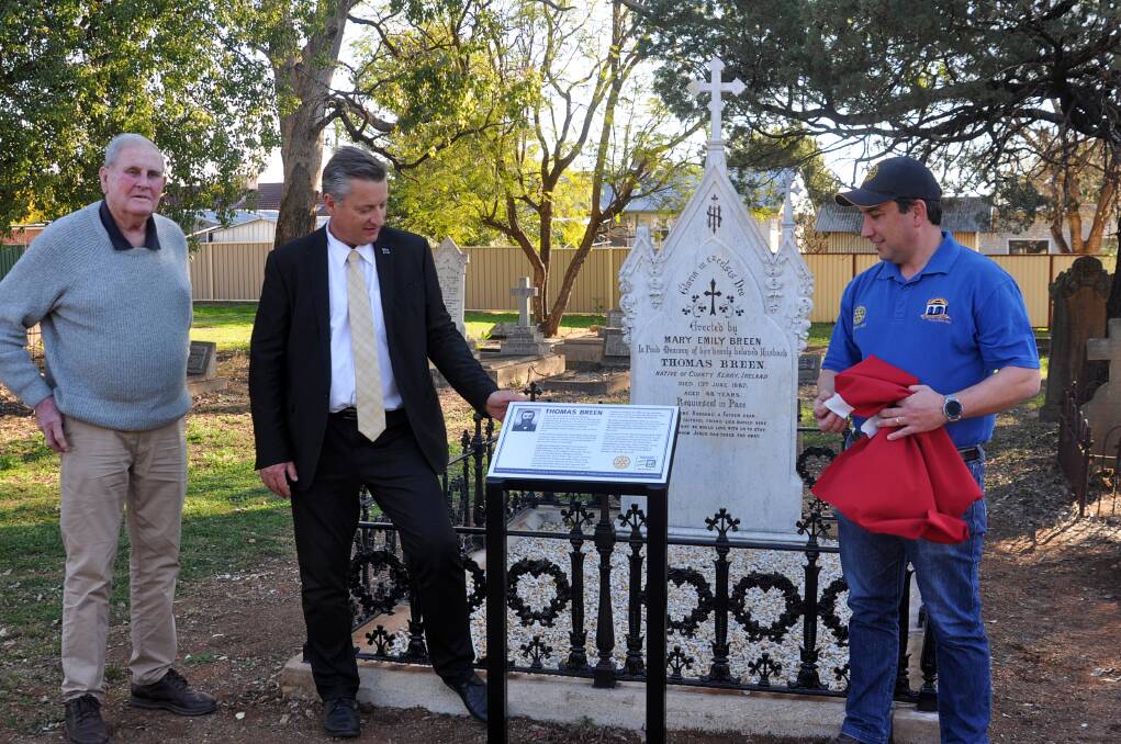Gunnedah and District Historical Society's Bob Leister, current Gunnedah mayor Jamie Chaffey and Rotary West's Nataniel Gomes with the restored gravestone of Thomas Breen. Photos: Marie Hobson
