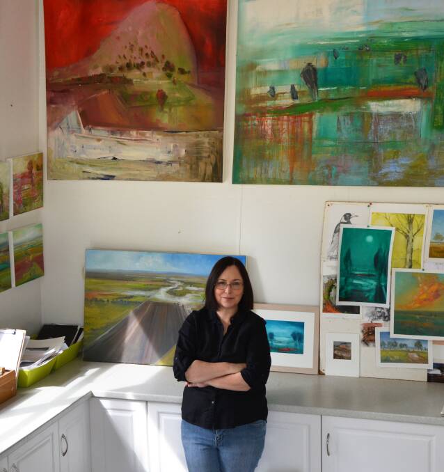 Curlewis artist Maree Kelly surrounded by her own works in her home studio. The artist was filled a sketchboard with images from her own "backyard" for the Arts North West Panorama Project. Photo: supplied