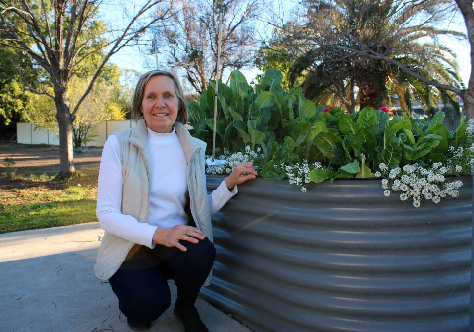 TurningPoint's Kim Gibson in the communal garden.