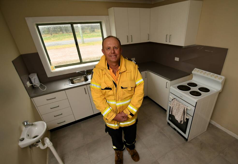 Gunnedah RFS captain Wayne Langdon in the kitchen, which is part of the refurbishments.