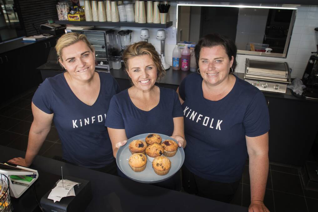Kinfolk Student Cafes' Kirsty Lawlor, Lisa Davis and Jenna Patterson behind the counter at the pool kiosk. Photo: Peter Hardin
