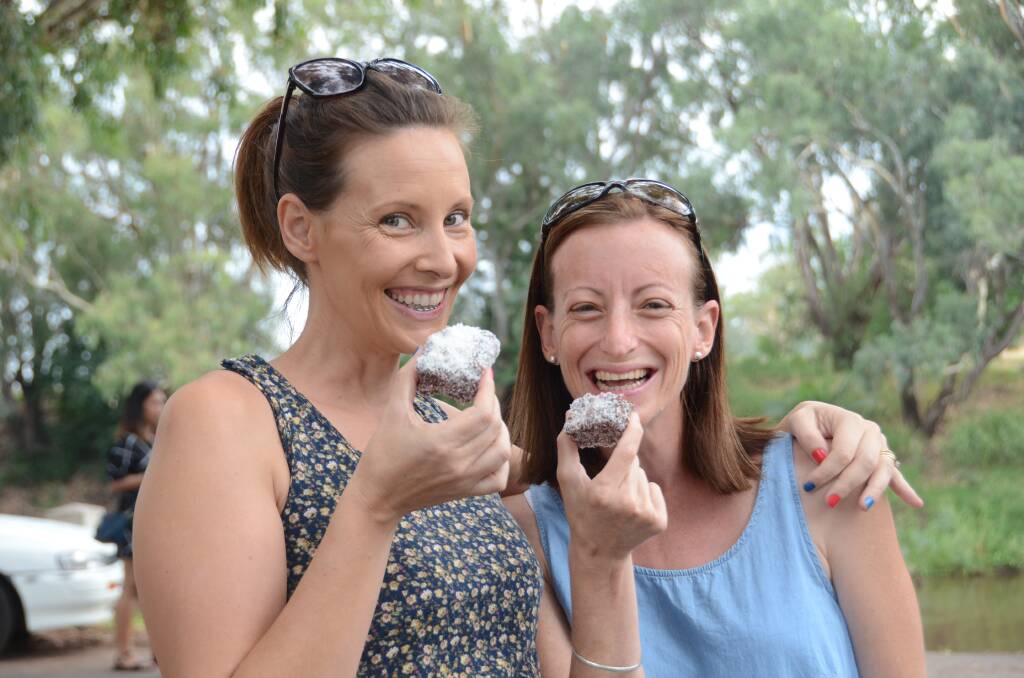 AUSSIE FLAVOUR: Locals Katie Avard and Jemma Martin sample some homemade lamingtons at Gunnedah's Australia Day celebrations last year.