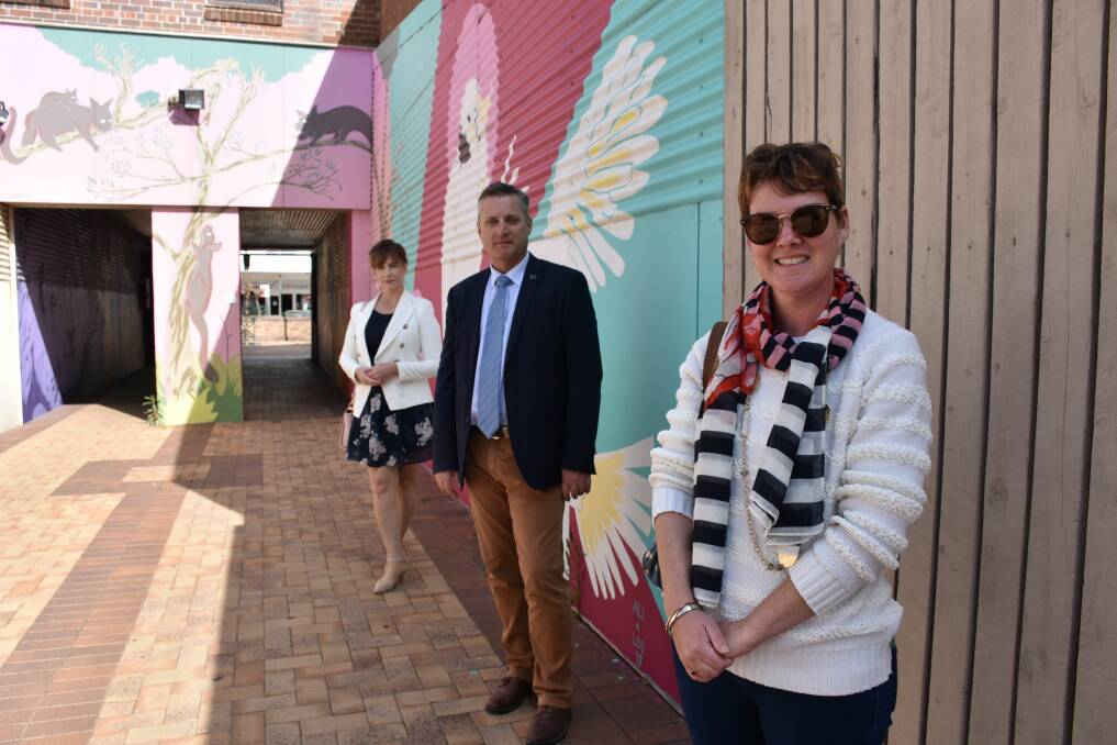 Arts Gunnedah's Michelle Wellham and Jade Punch with Gunnedah shire mayor Jamie Chaffey in the alleyway where the new collaborative mural will be painted. Photo: Marie Low