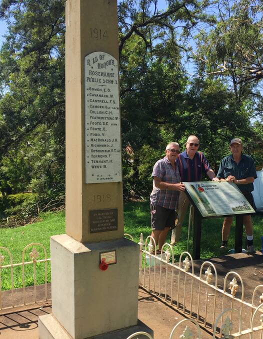 Gunnedah Lions Club members Neville Steele and Bob Carter, pictured with Bob Leister. They installed a new information board about the Rosewarne memorial out the back of the Water Tower Museum. Photo: Marie Hobson