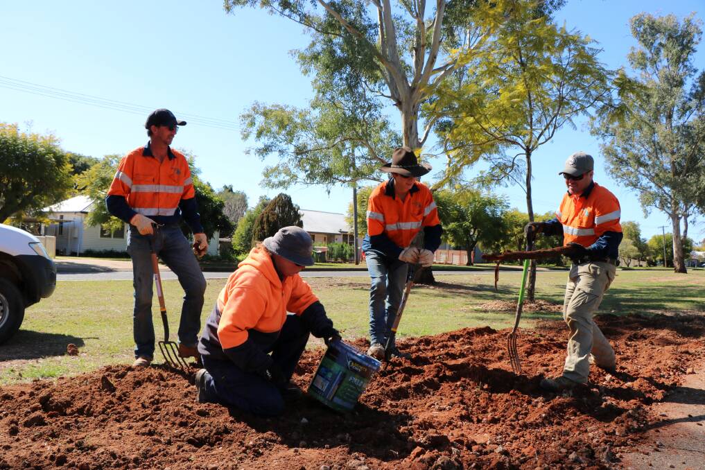 Farmer Army members Michael Crawford, Belinda Milgate, Thomas Gilmore and Ryan Marchant preparing a garden bed on Stock Road as part of the council's beautification project.