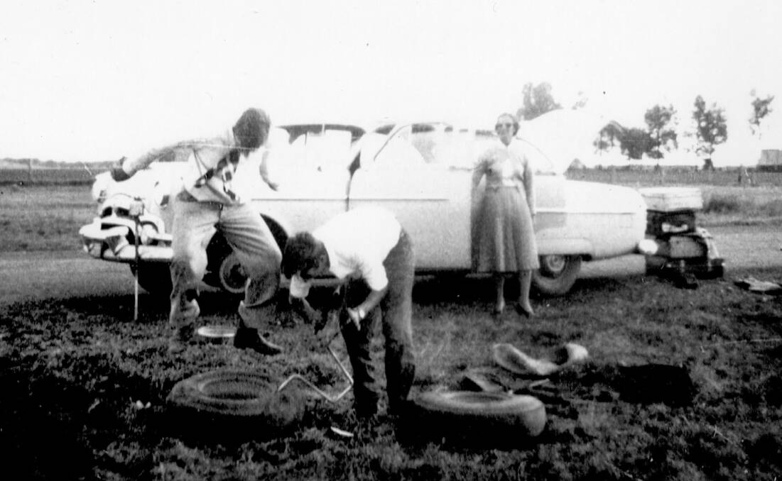 Changing and repairing a tyre between Goondiwindi and Mungundi. This photo is one of hundreds being considered for the project.
