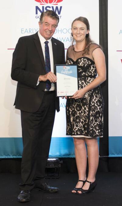Arts and cultural officer Lauren Mackley (right) is presented with her nomination certificate at the Young Achiever Awards on Saturday.