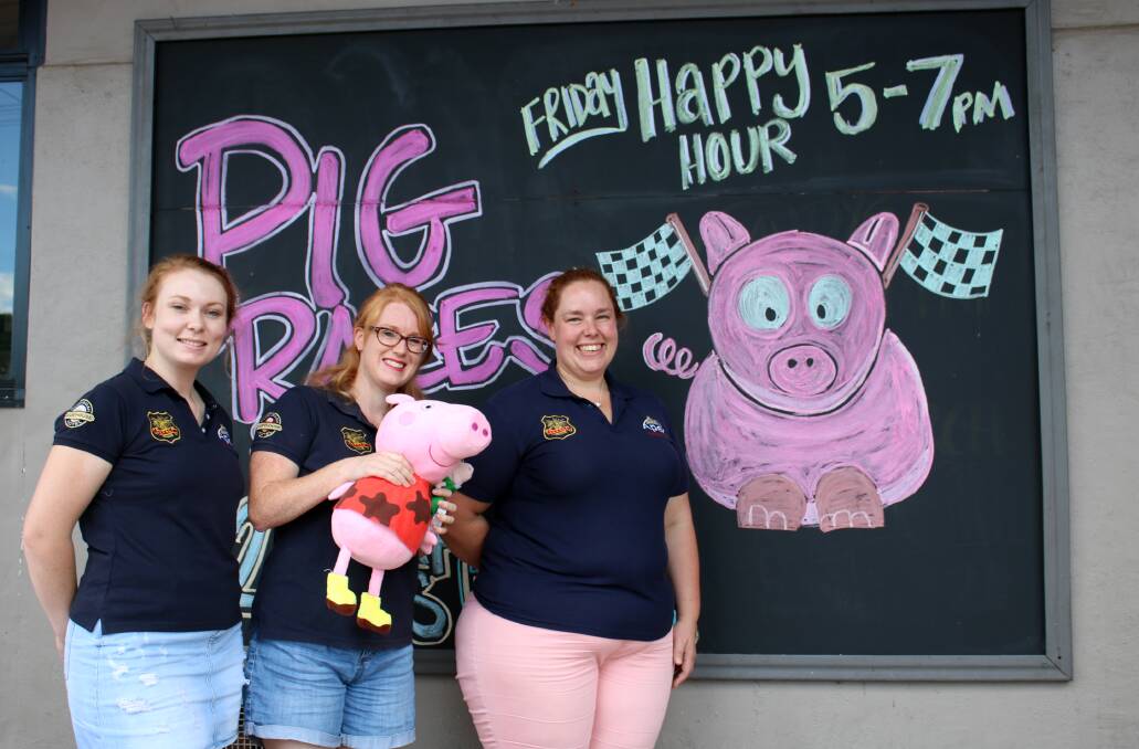 The Apex Club of Gunnedah is facing closure by Christmas without new members. Pictured are Nikole Brooks, Erin McCabe and Donna Austin in 2018 in the weeks leading up to the club's major fundraisers, the annual pig races.
