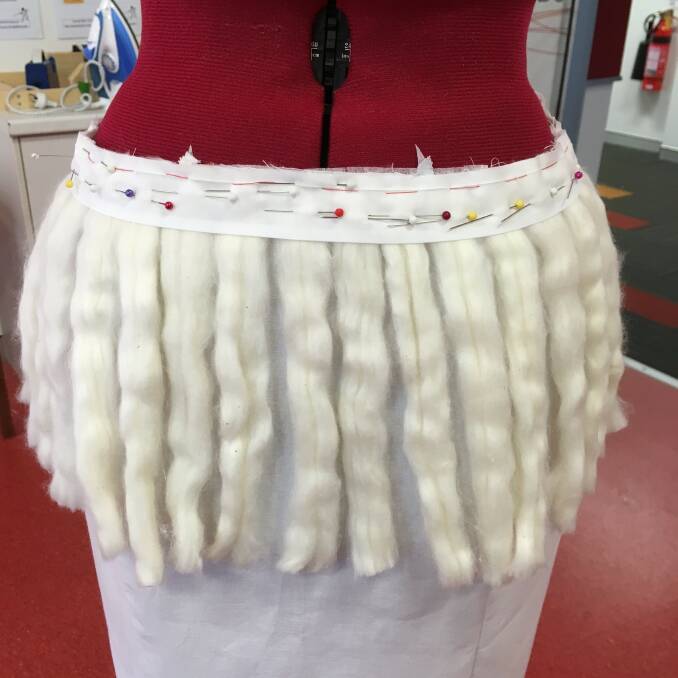 The skirt in early stages with carded cotton pinned on. Photo: Issy Gourley