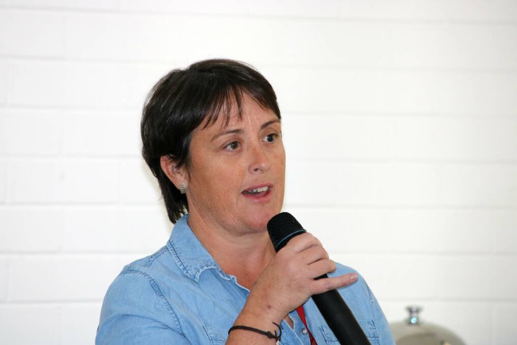 Gunnedah resident Rebecca Ryan directs her question at the candidates about gun laws.