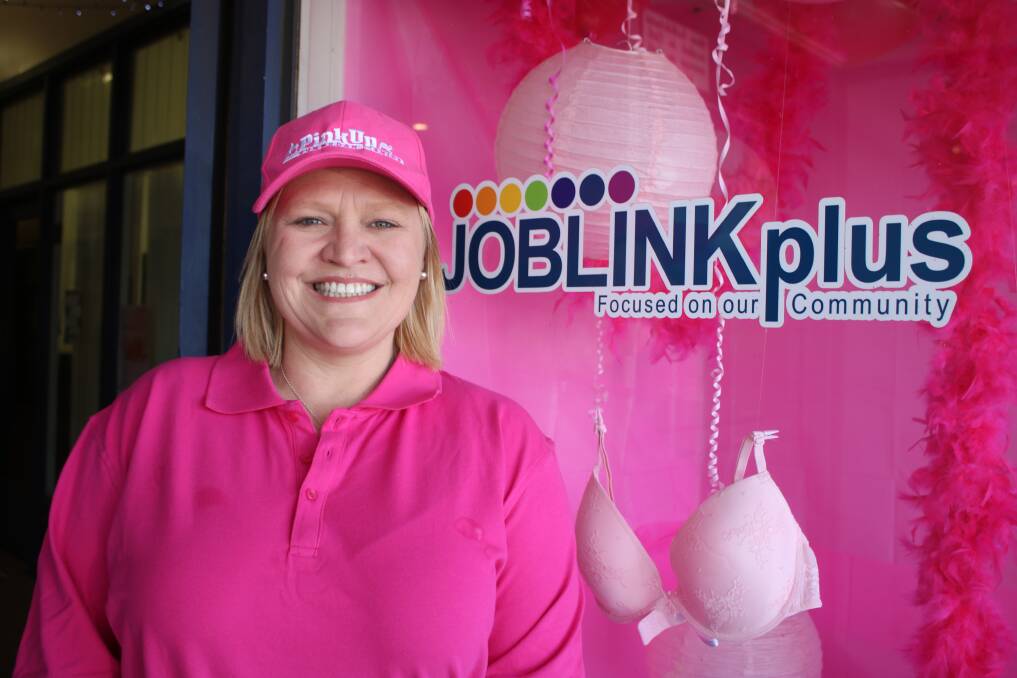 AWARENESS: Pink Personality Prue Jeffrey has dressed up the window of her workplace for the Pink Up Gunnedah campaign.