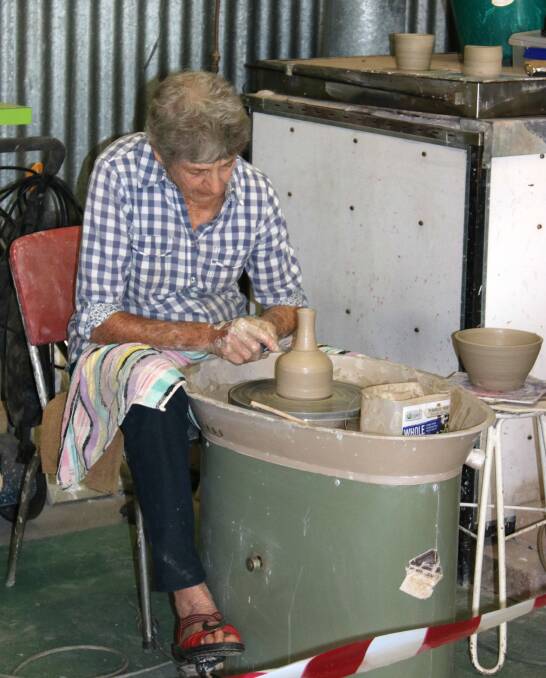 Gunnedah Pottery Club member Pat Tobin in the pottery shed in the showground. The club received funding last year to install airconditioning.
