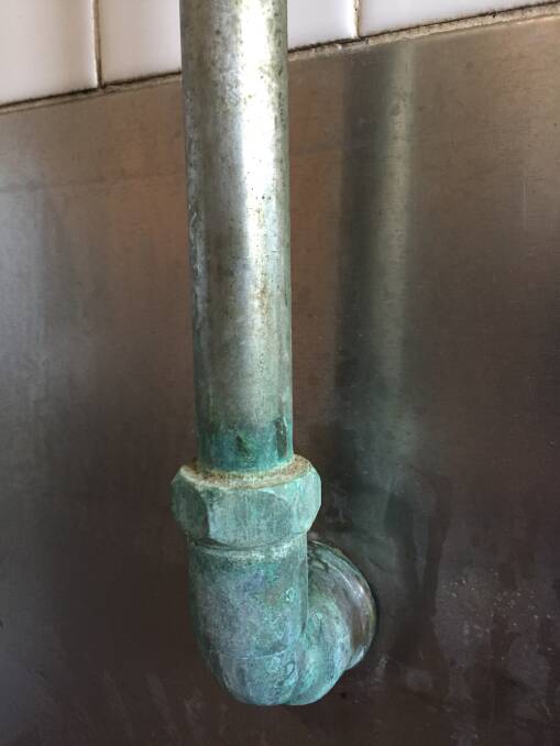Calcium build-up on a pipe.