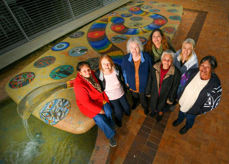 SISTERHOOD: Kamilaroi women Gloria Foley, Janet Wanless, June Cox, Cindy Foley, Shirley Long, Alison Cox and Rita Long will long be remembered for the parts they played in bringing Gunnedah's Rainbow Serpent water feature to life. Photo: Gareth Gardner