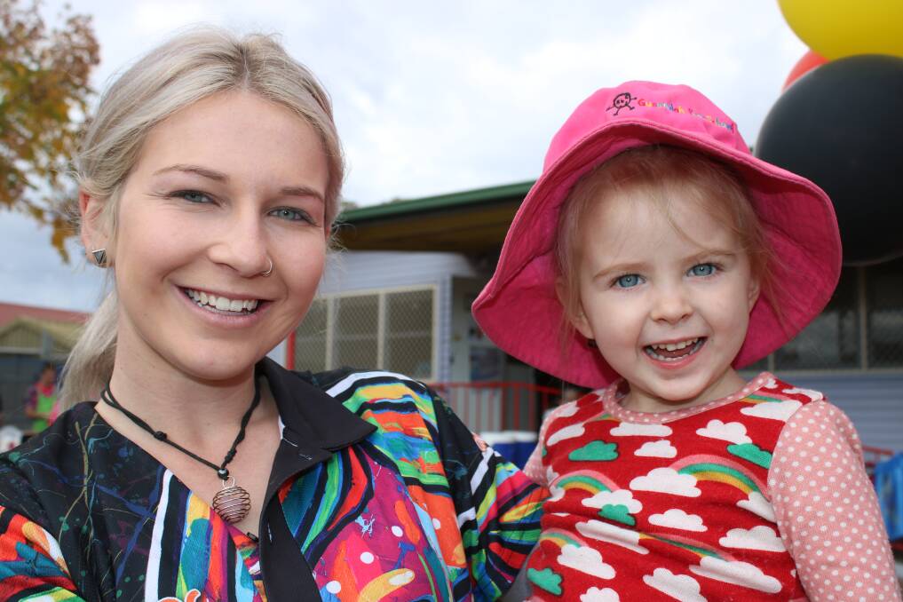 Gunnedah Preschool is over the moon about its results in the National Quality Standards. Pictured are educator Braie Devine with Alex Naughton during NAIDOC Week.