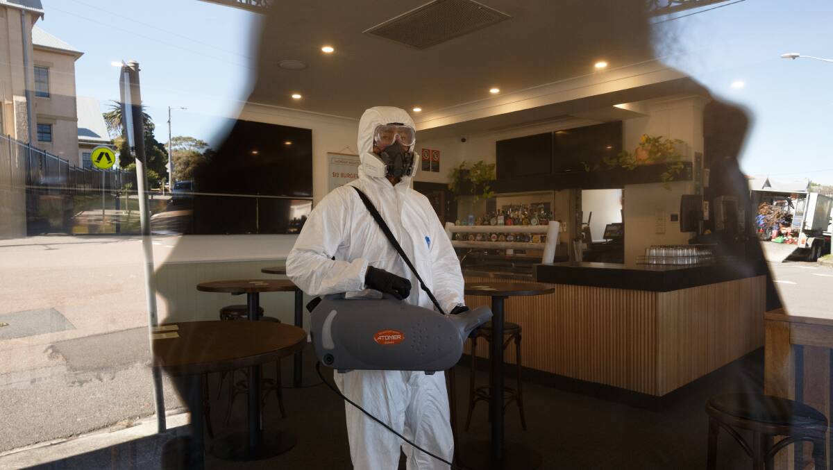 CORONAVIRUS: Cleaning crew fumigates a room as part of a deep clean of the Bennet Hotel pub in Hamilton in August. Wednesday, August 6, 2020. Picture Max Mason-Hubers