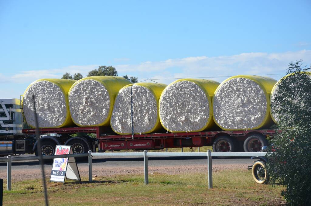 ON THE MOVE: One of hundreds of trucks carrying cotton makes its way through Breeza. Photo: Billy Jupp 